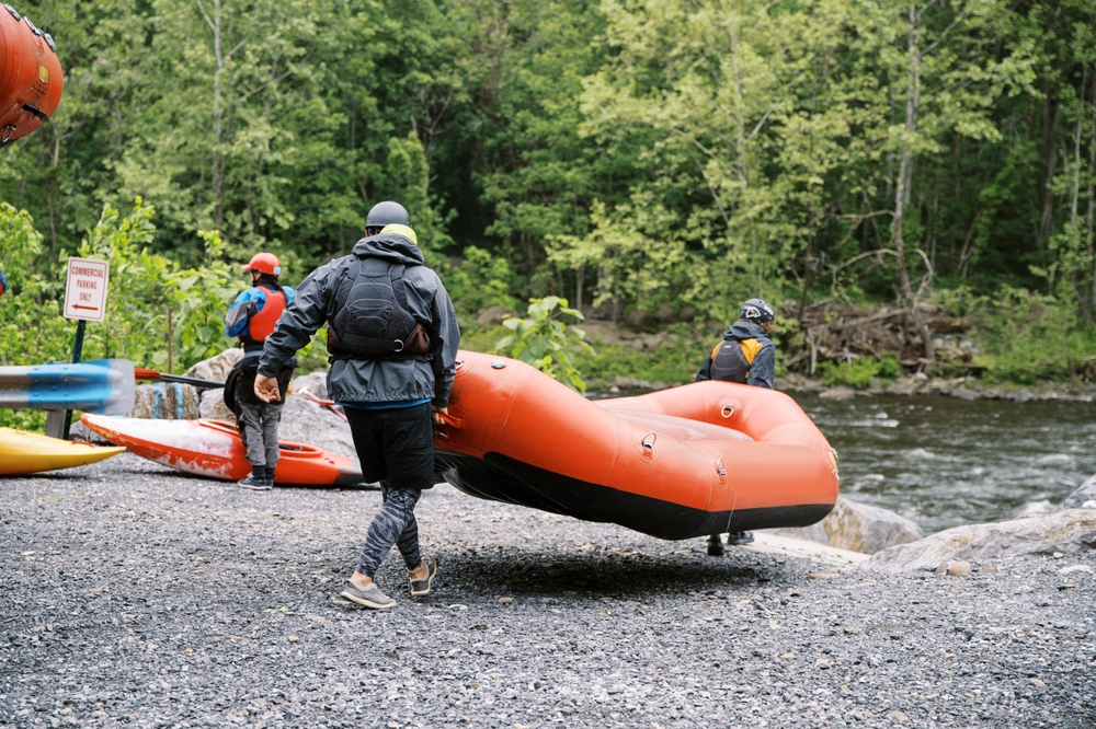 carrying white water raft to Pigeon River