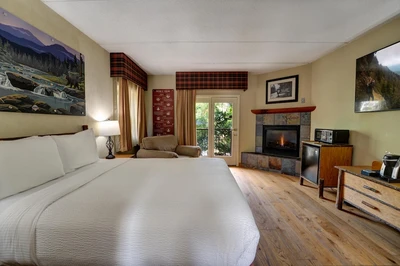 Bearskin Lodge room with balcony and fireplace