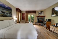 Bearskin Lodge room with balcony and fireplace