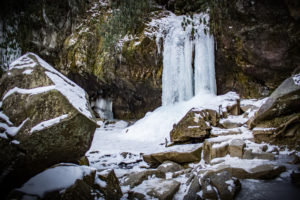 grotto falls in the winter with snow
