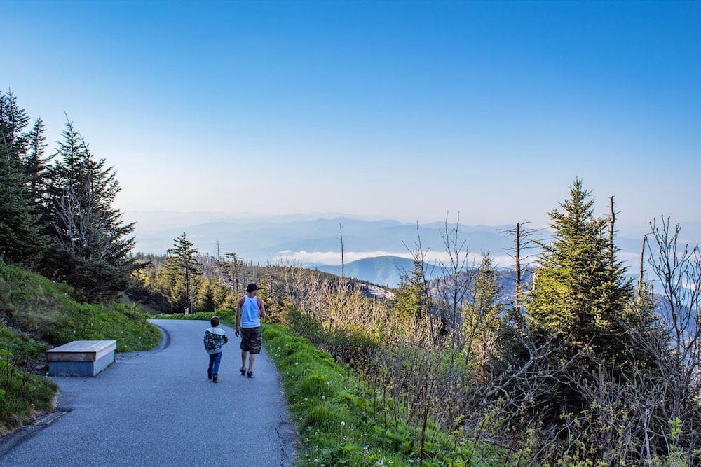 father and son walking to Clingmans Dome